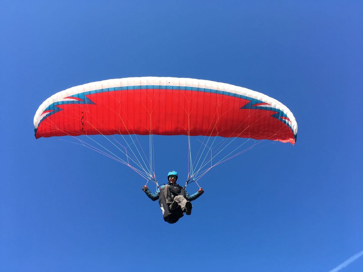 Chris Williams, who was airlifted by Wiltshire Air Ambulance, paragliding in the skies