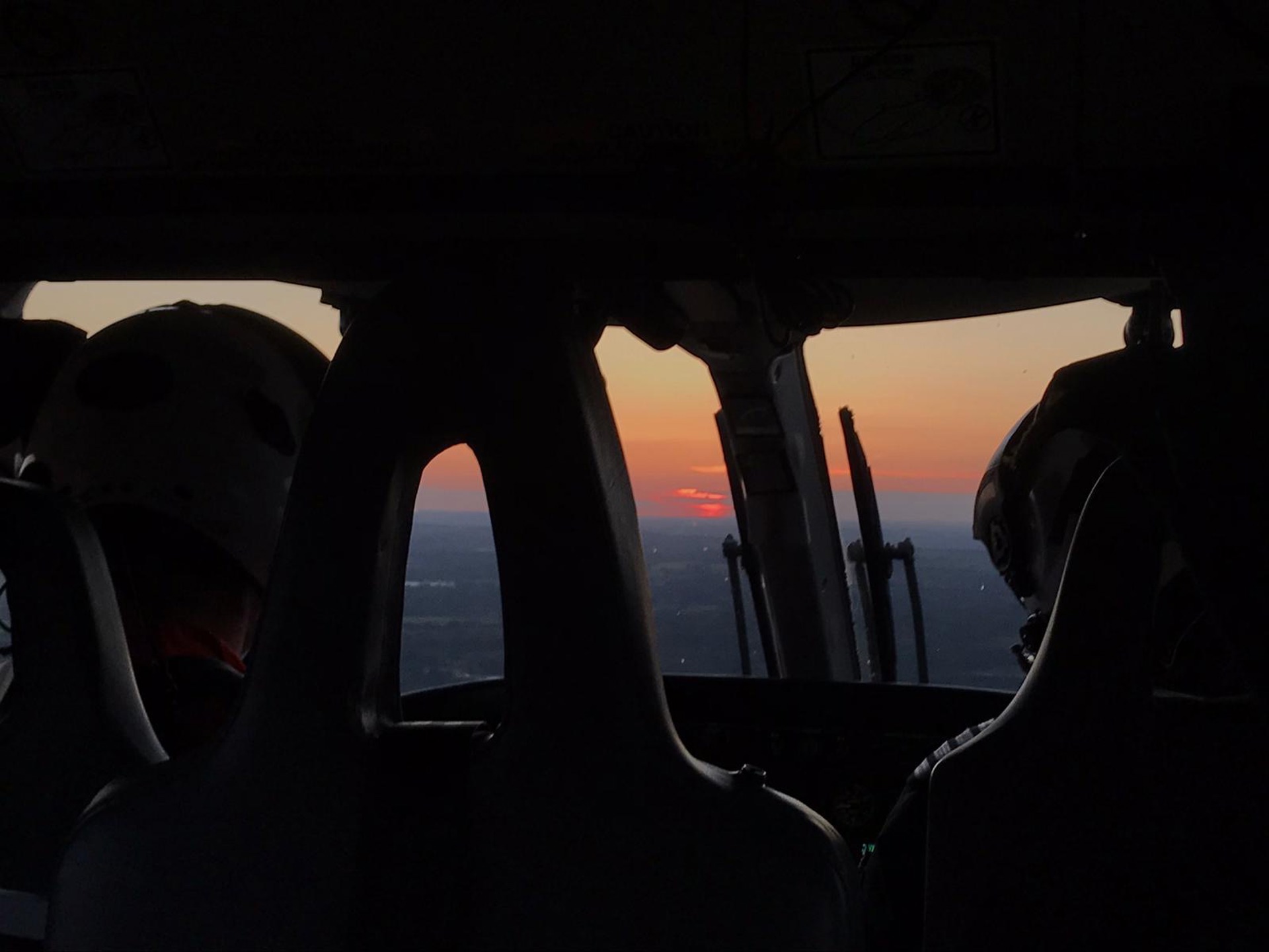 Sunset view from inside of a helicopter