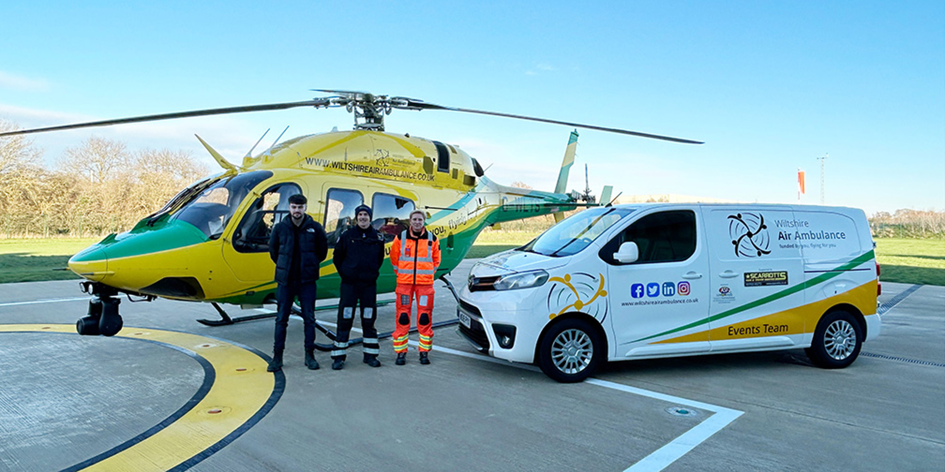 The WAA helicopter with the charity's new events van on the helipad