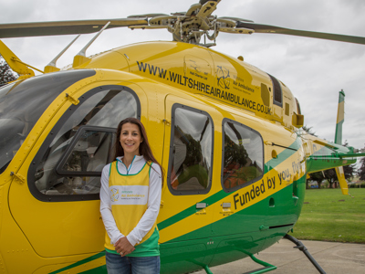 Shelley Rudman stood in front of the WAA helicopter