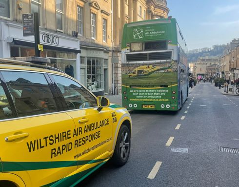 Wiltshire Air Ambulance's critical care car with a branded Wiltshire Air Ambulance bus