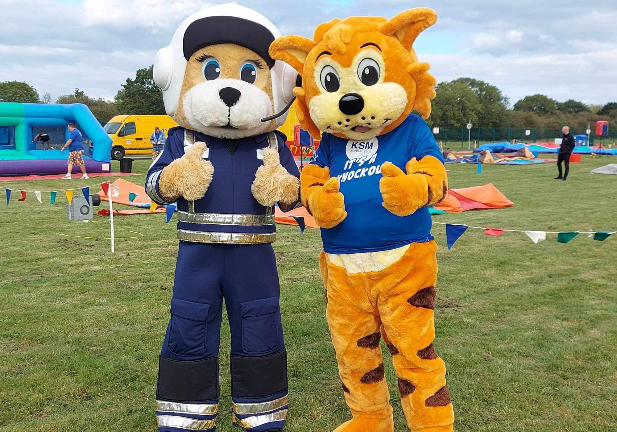 Two mascots posing at Wiltshire Air Ambulance's It's a Knockout 2023