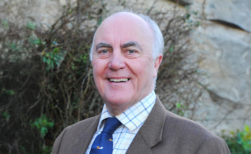 A headshot of Richard Youens stood outside